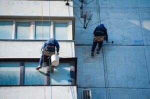 professional commercial exterior painters in New Hampshire preparing building for exterior painting