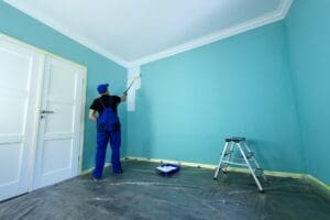 Homeowner avoiding common painting mistakes with expert interior painting from Miles Pro Painting