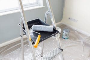 Homeowner avoiding common painting mistakes with expert interior painting from Miles Pro Painting